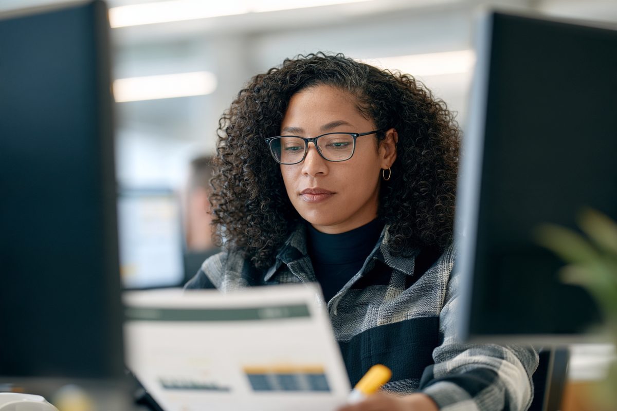 Analyst reviewing a performance report